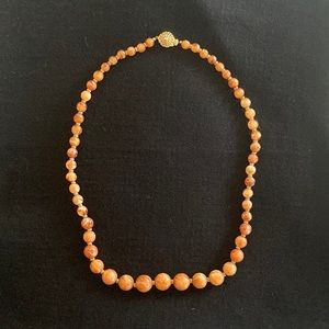Vintage rust colored, marbled bead necklace. Beads 1/4 inch to 3/4.